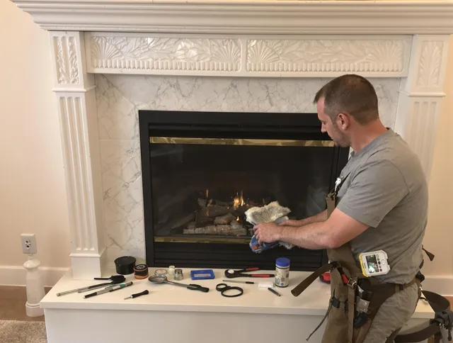 Lynnfield Chimney Sweep performing fireplace maintenance in Lynnfield, MA
